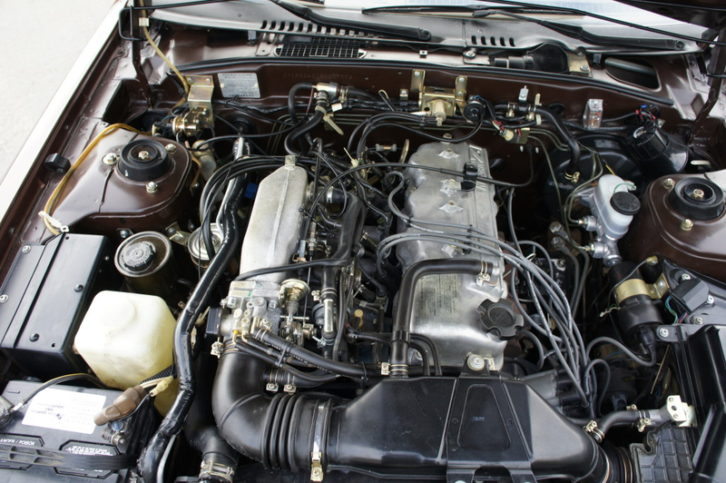 Illustration for article titled For $6,500 — top down and brown, loaded up and Datsun